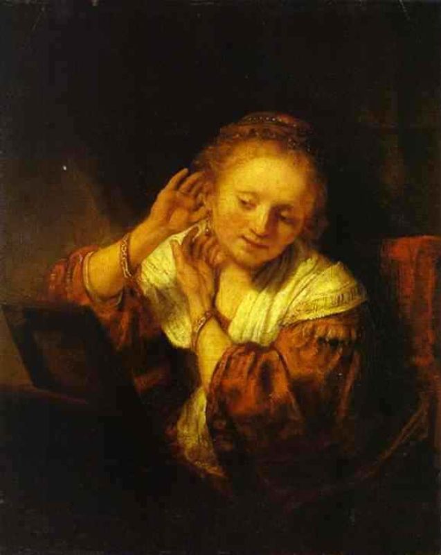 a young woman trying on earings.jpg